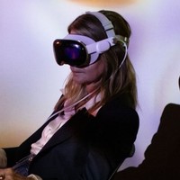 Woman with apple headset on testing VR projects Woman with apple headset on testing VR projects